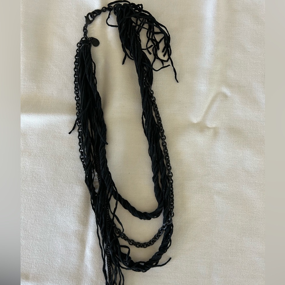 Purchased in Paris a black leather and metal necklace